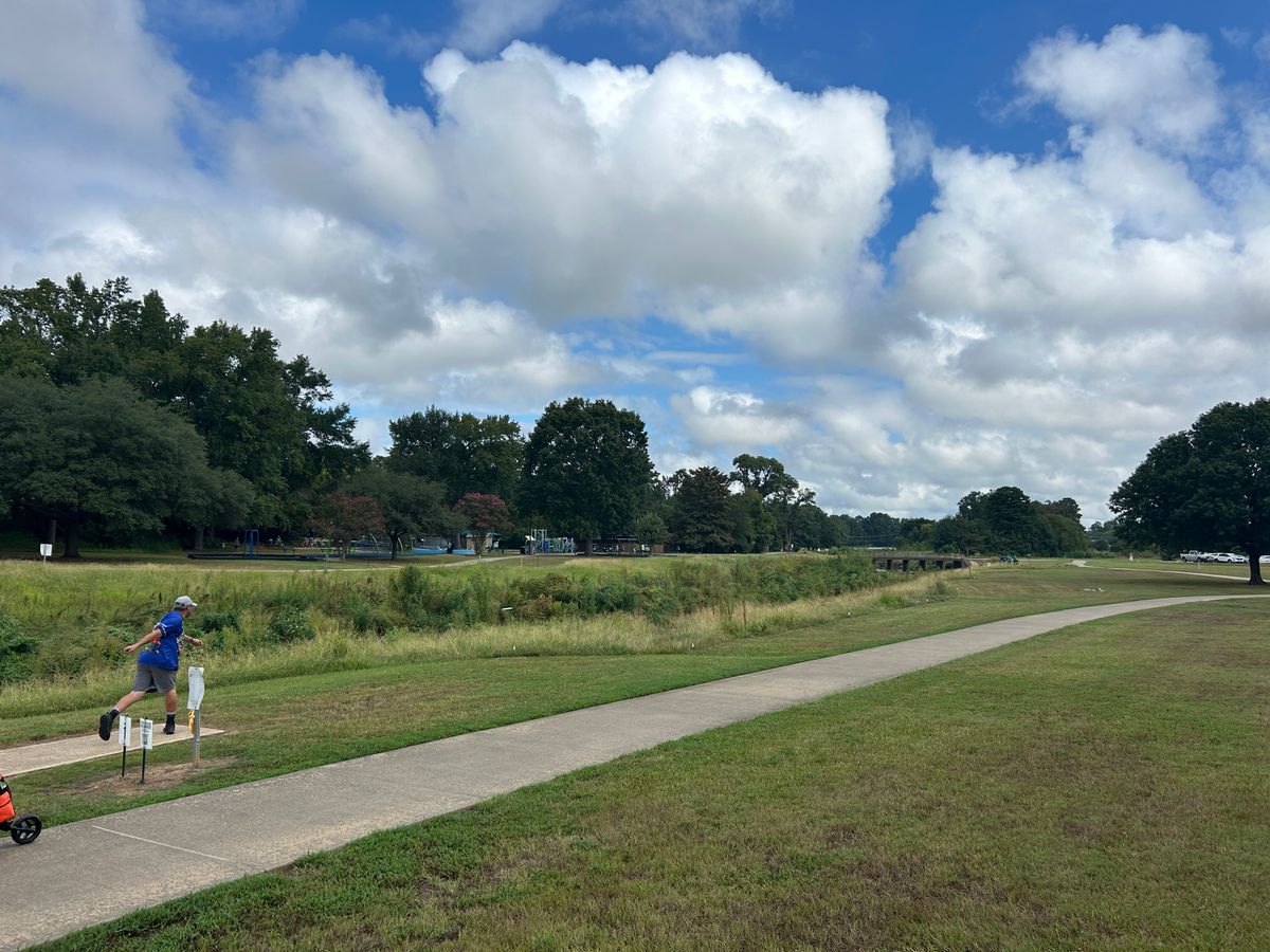 Hole 1. Par 4 tournament OB left and sidewalk and over to the right.