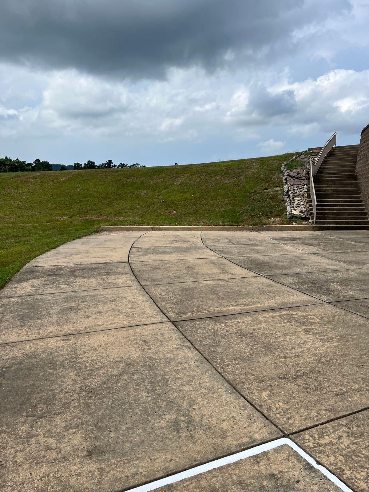 Tee from behind the paint. If OB in parking lot the drop zone is the concrete at the top of the stairs next to the parking lot. 