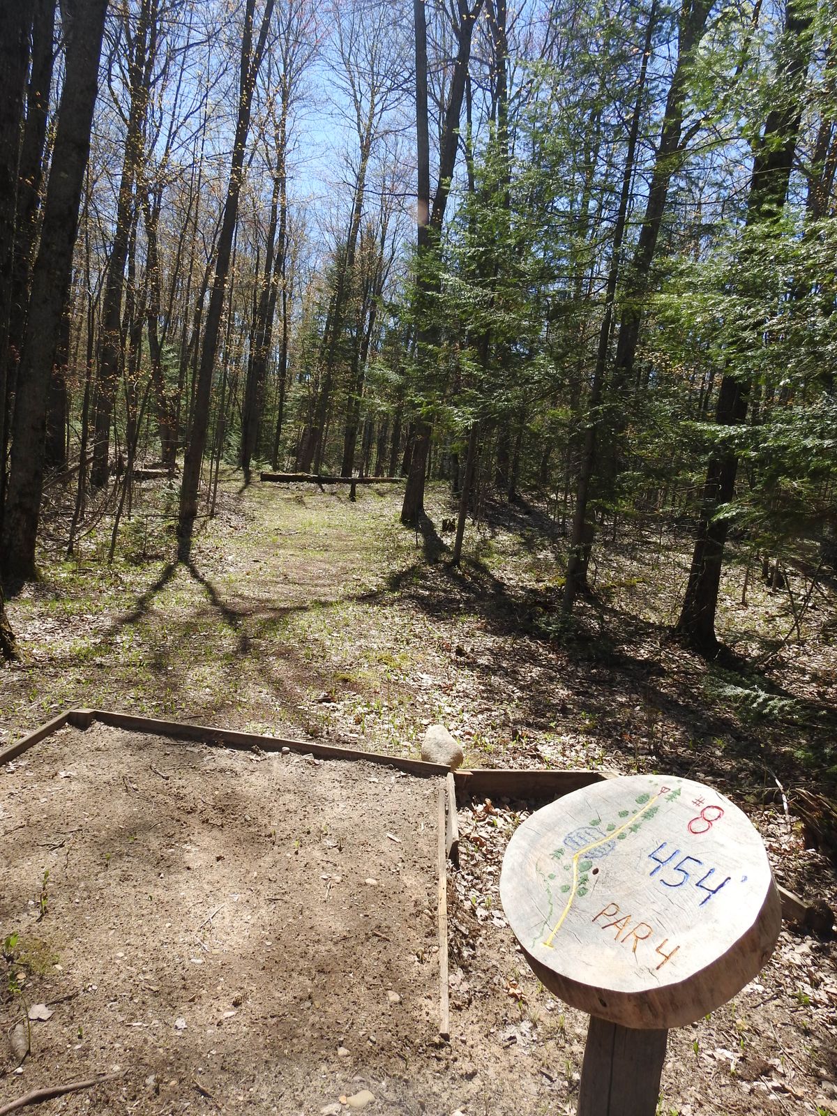 Down hill to edge of pond, then over pond and up hill.