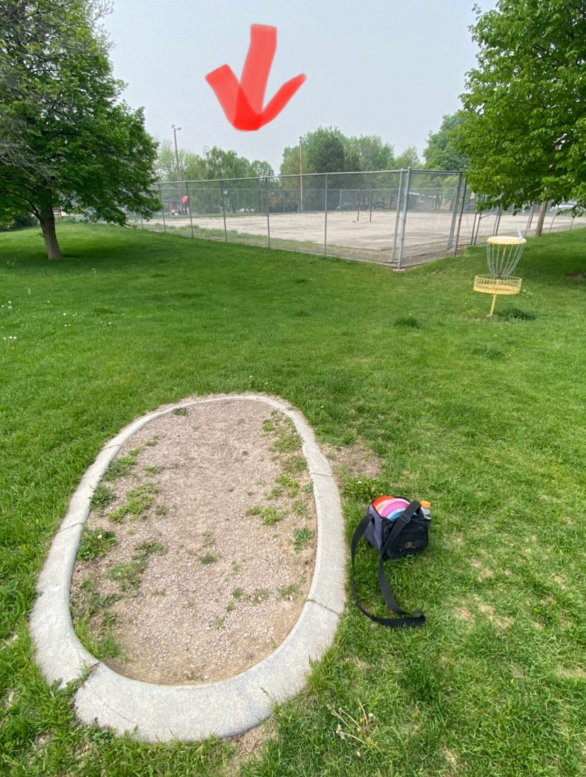 Hole 8, playground on other side with basket behind that