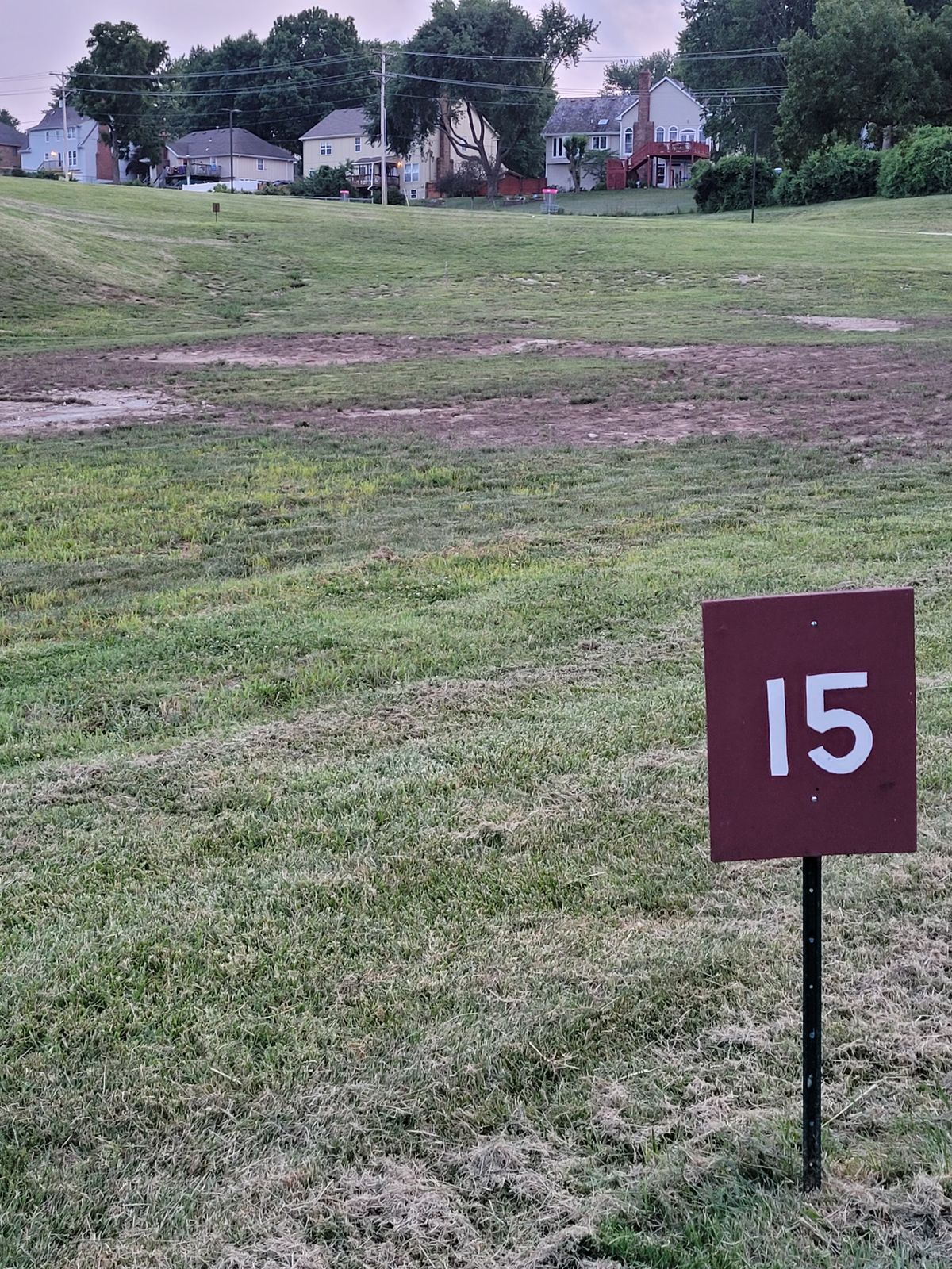 Hole 15
On a hill with roll away on backside of basket.