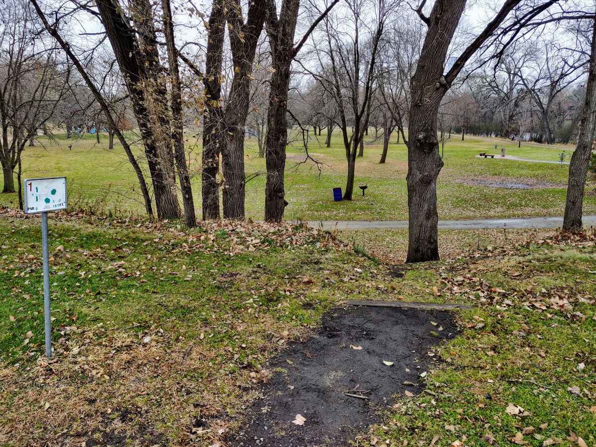 First tee, dirt tee pads. Slippery when wet.