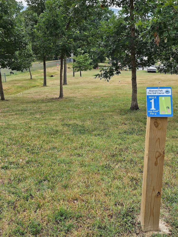 Hole 1 sign and fairway