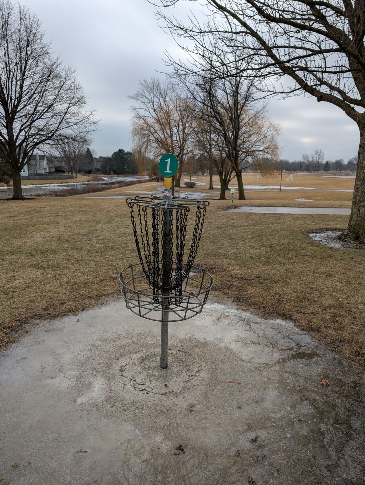 winter golf , creek half frozen