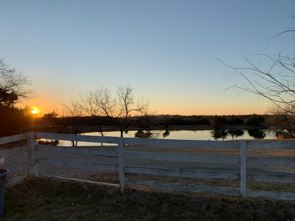 Sunset over the water hazard.