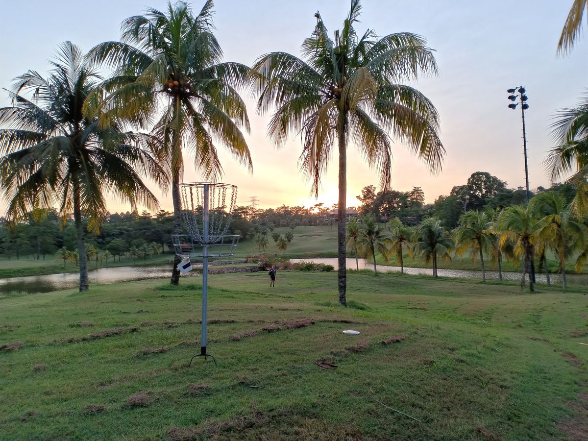 Pulai Springs Disc Golf Course, Hole #12 from basket looking back down at the tee pad.