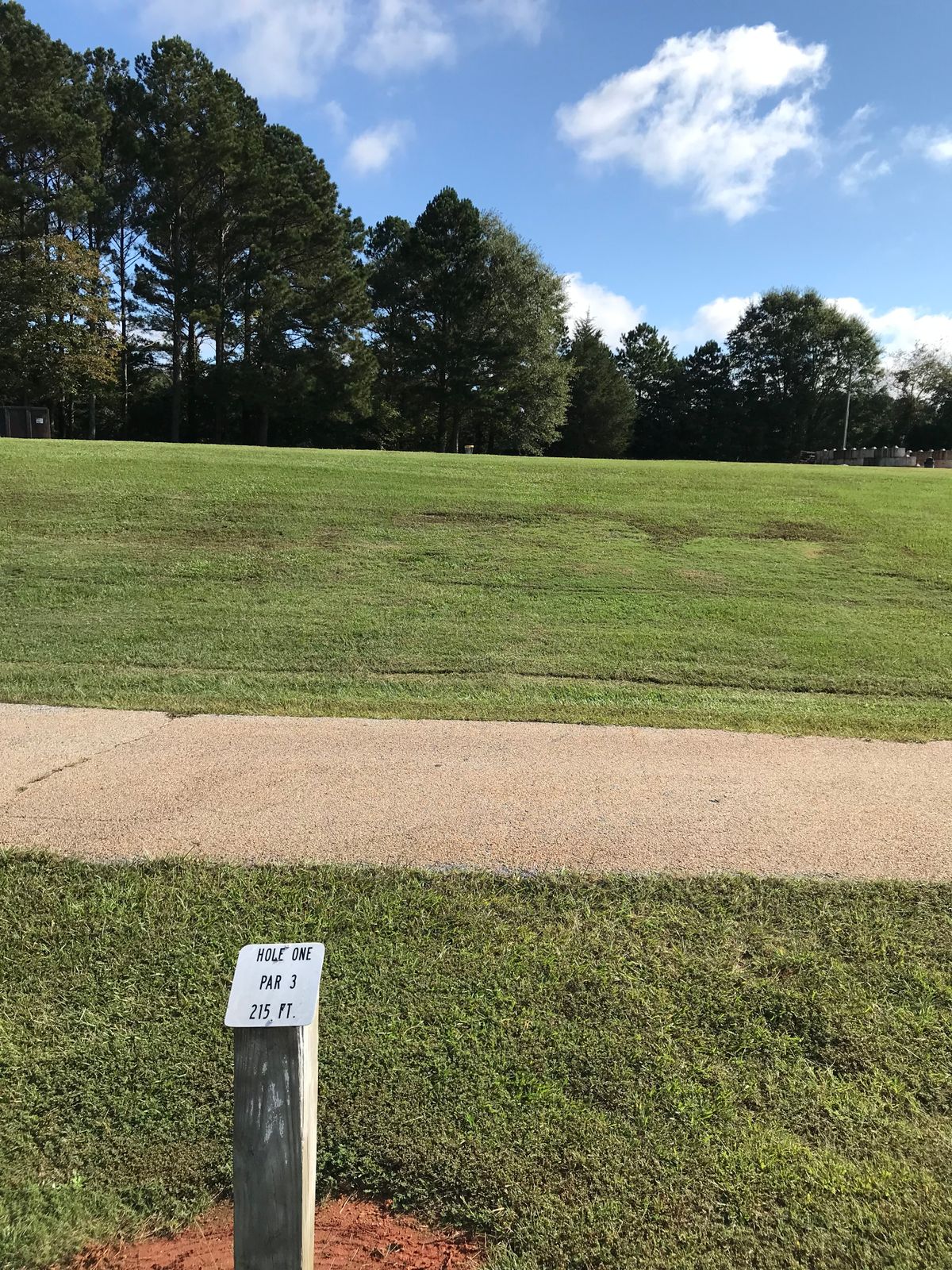 Hole 1 starts at the parking lot close to the maintenance building.