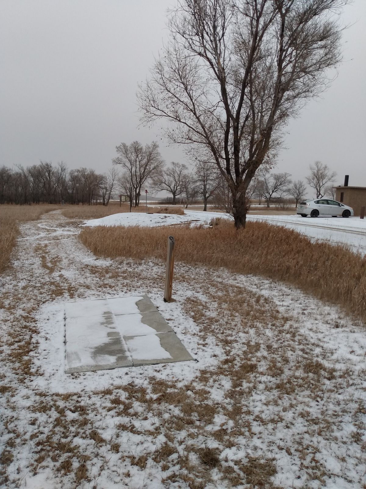 9th. Tee Pad is next to a couple of vaulted toilets.