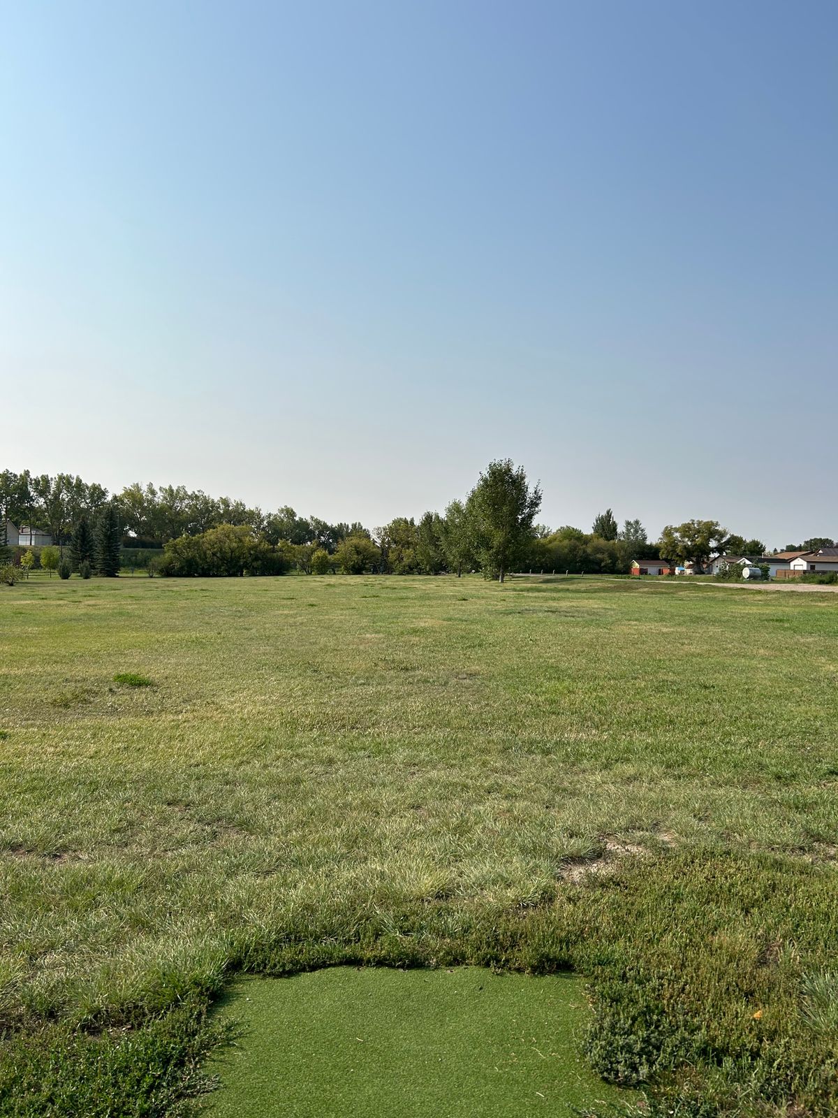 Hole 11 - walking path and beyond to the left OB as well as gravel road and beyond on the right