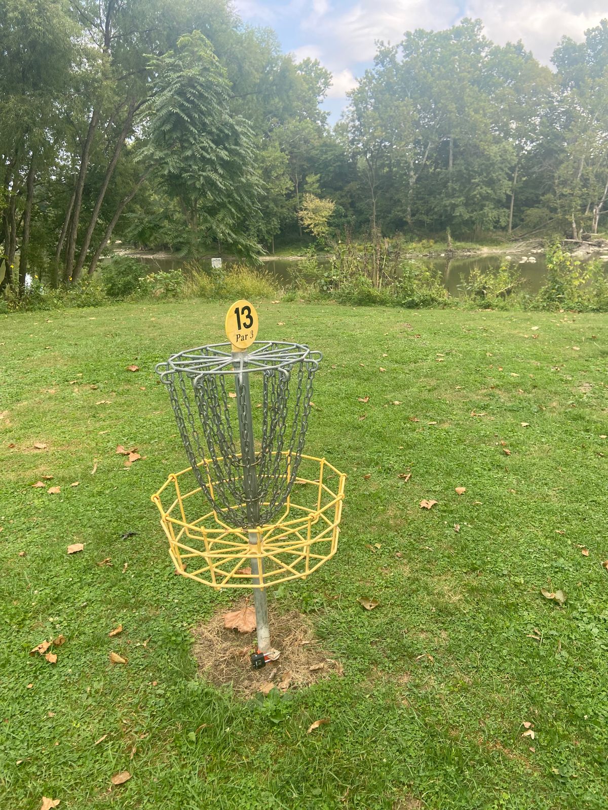 Basket on 13 with water hazard in background