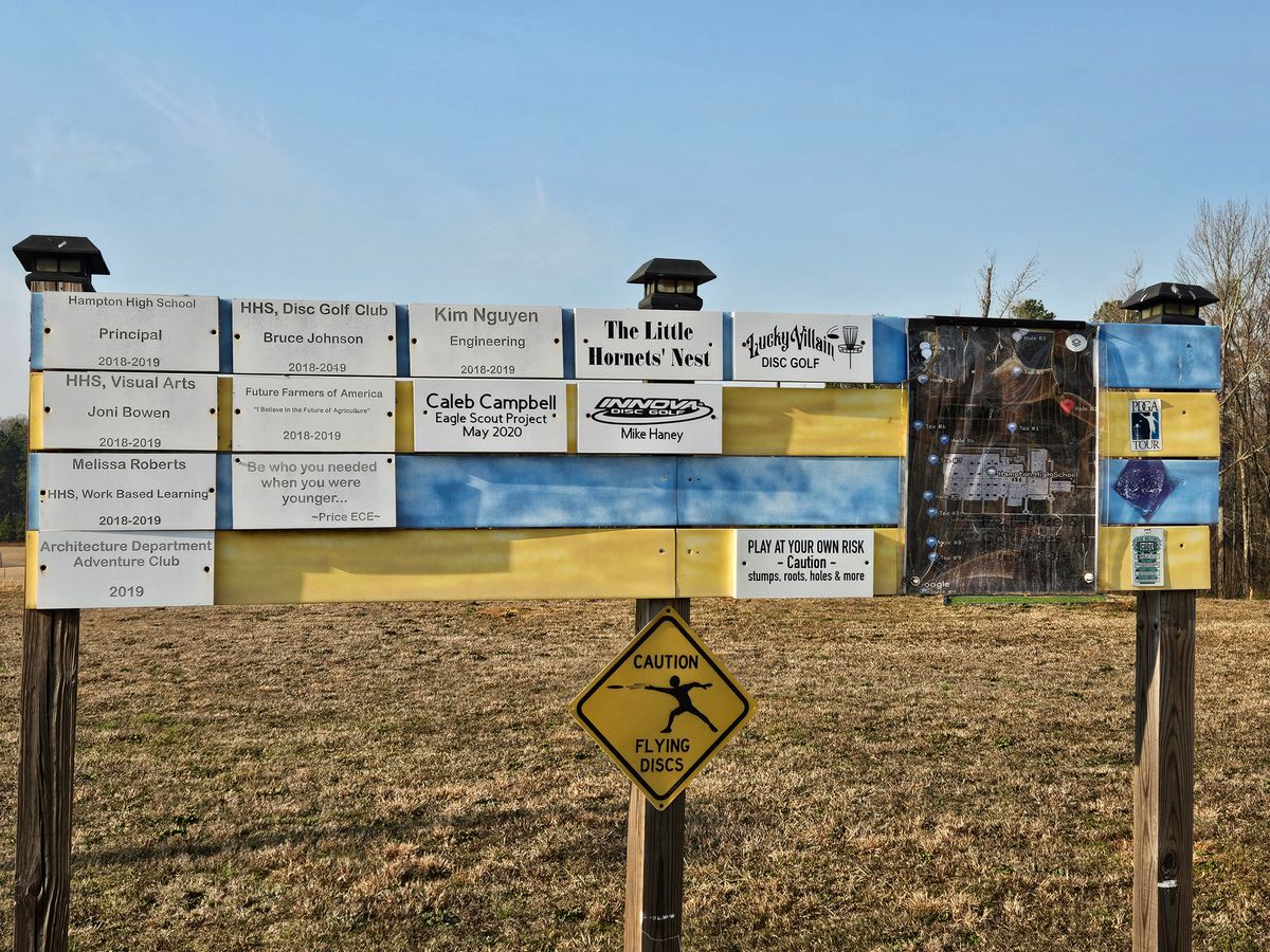 Sponsor sign near practice basket and hole 1.