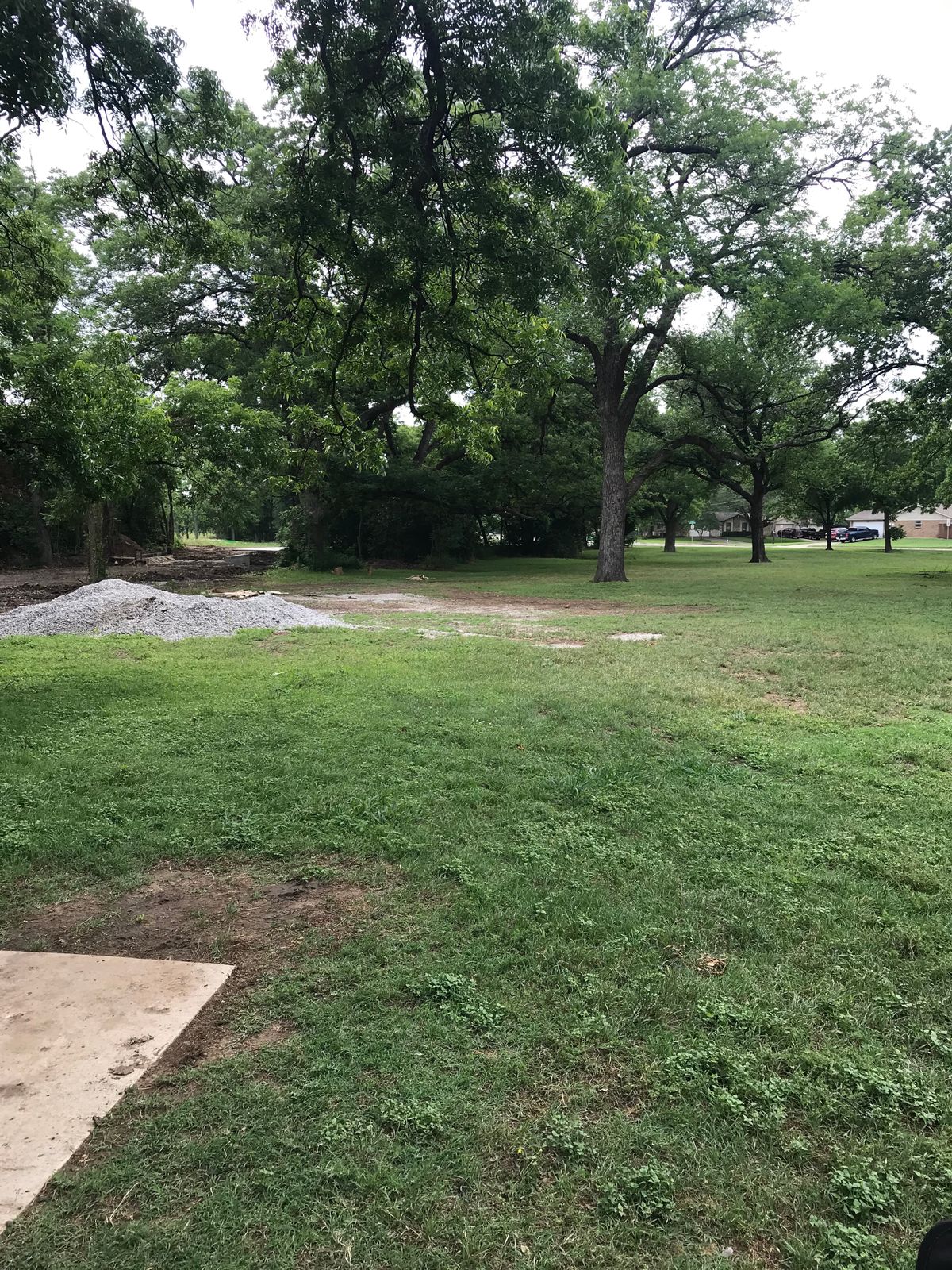 Hole 11 basket to the right of the new sidewalk.