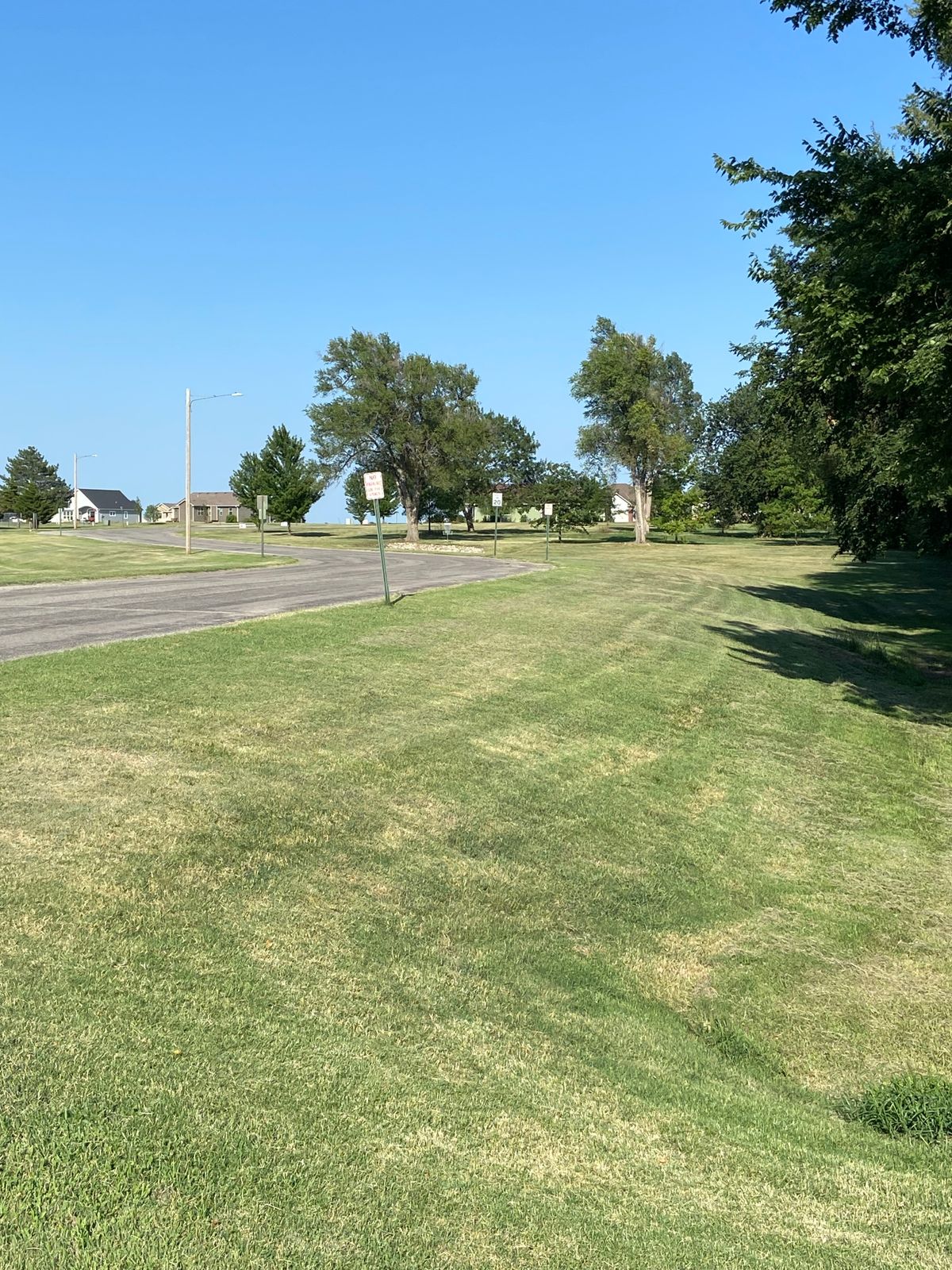 Hole 5…OB on the road and to the left, basket is above the rocked hill