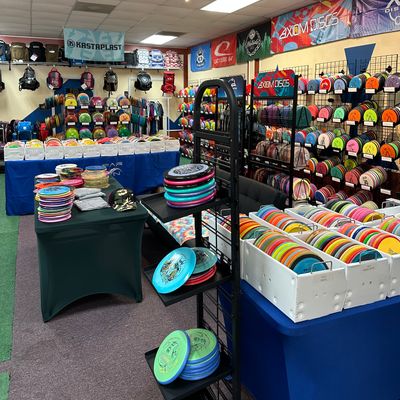 Used disc bins, new arrival rack and table, couch.