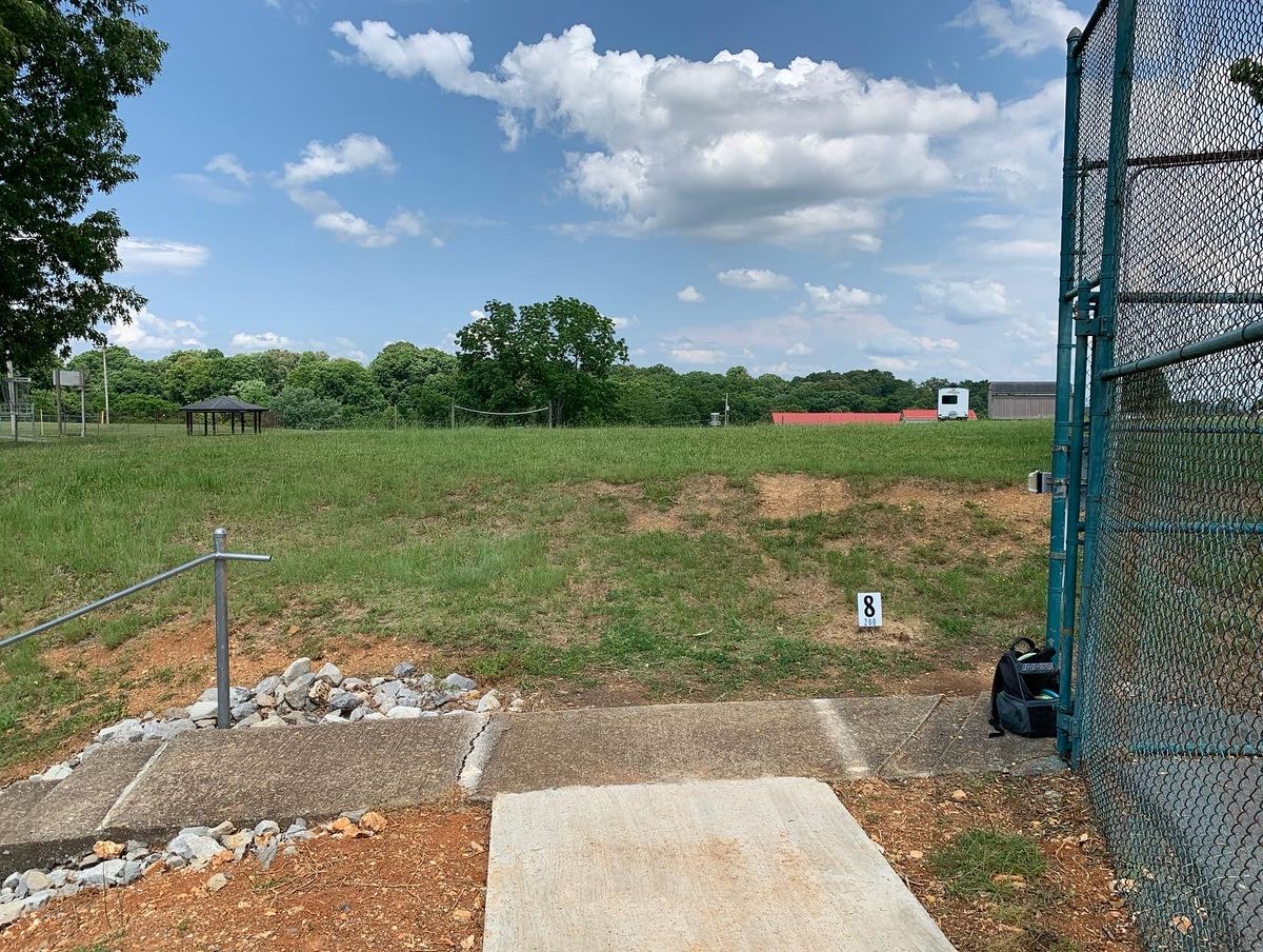 Hole 8 Tee Pad next to basketball court.