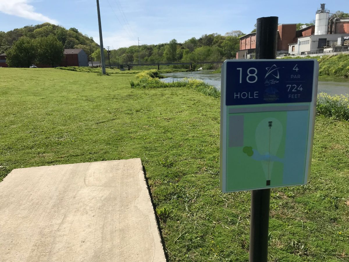 No. 18 tee looking at basket straight ahead. Course’s longest hole. River plays to right all the way