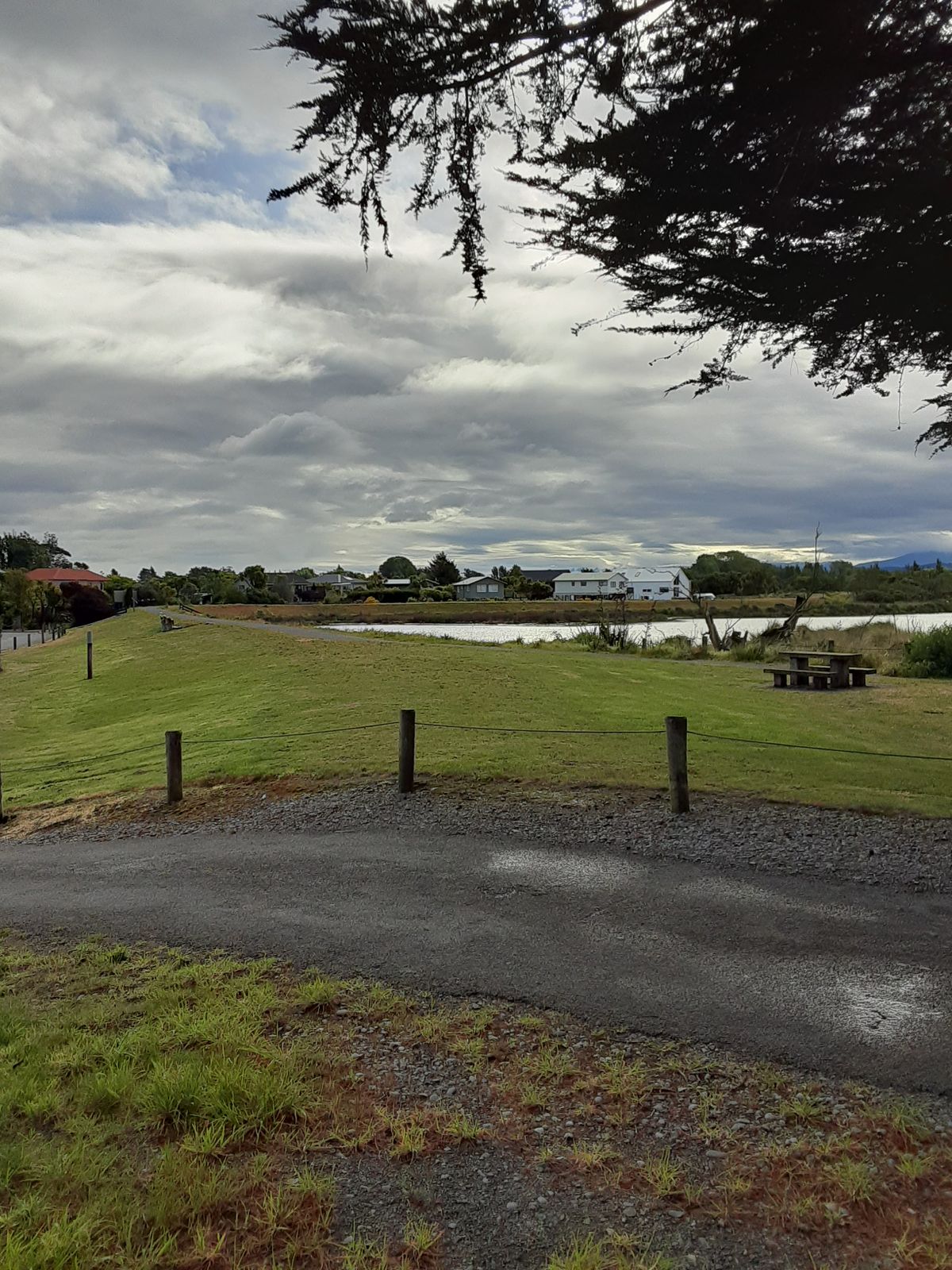 Road you drove in on with 19th hole on left and 1st tee on path.