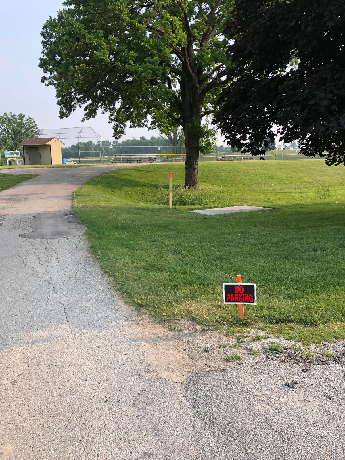 Put up no parking signs on hole 1.