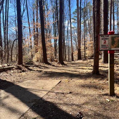 New tee sign and cleared fairway.