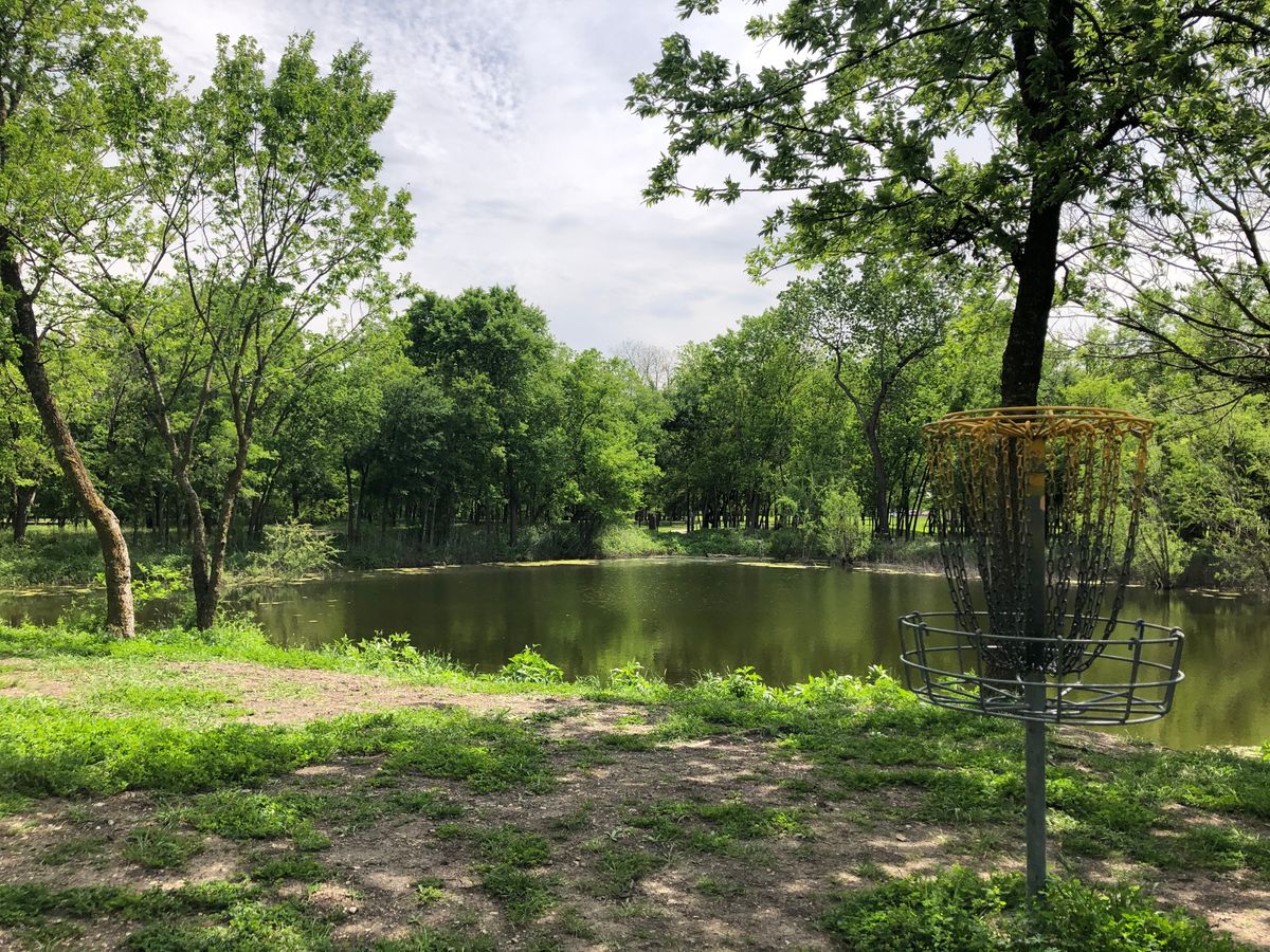 Basket 12. Looking over water back to the pro tee (Tee Pad A).