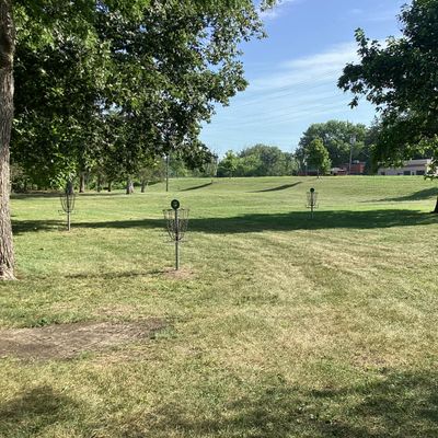 Putting green next to shelter. All baskets are approximately circle-one distance apart.