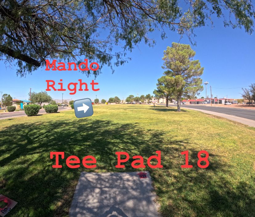 Tee Pad 18. Mando right of dumpster enclosure.