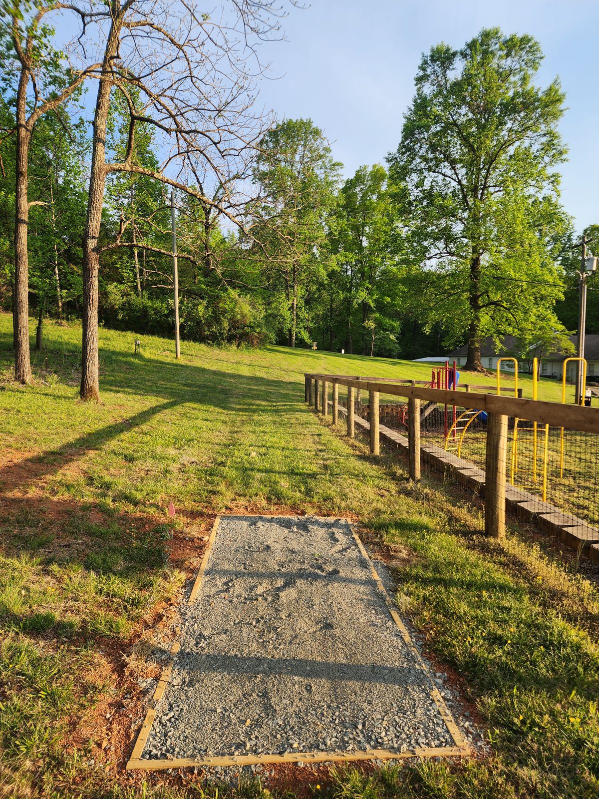 New hole 10.  Tee pad along playground fence