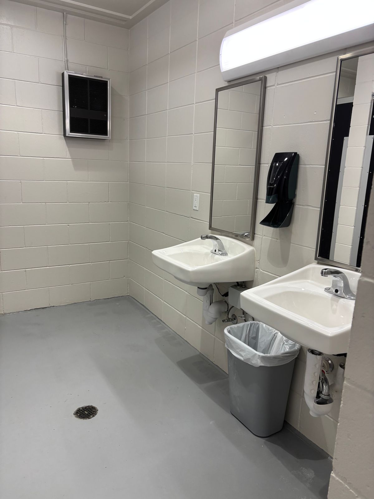That’s a heater on the wall, and there is soap and a hand dryer.