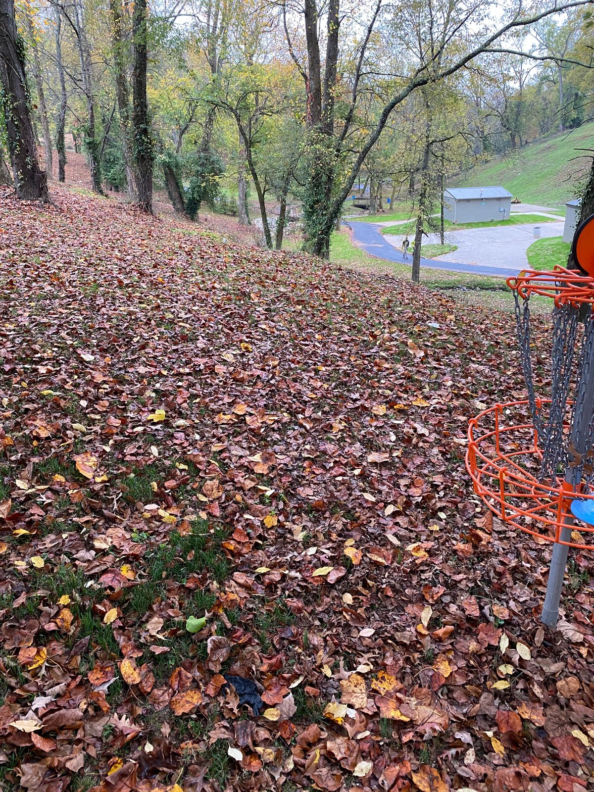 Looking down at the teepad from hole 9’a basket.