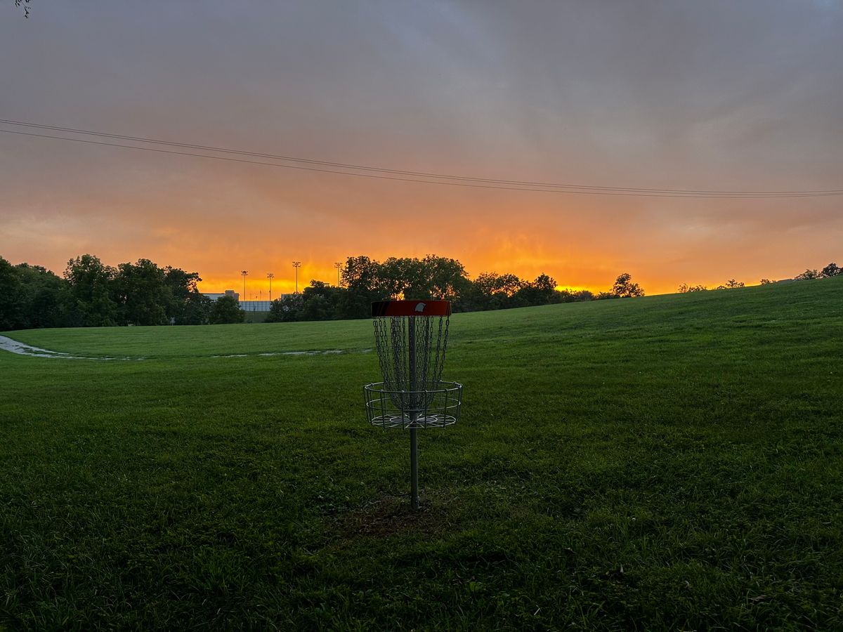 Hole 6 basket at sunset