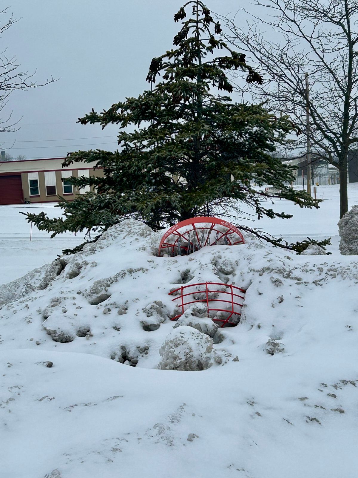 Hole 7 basket buried by plow.