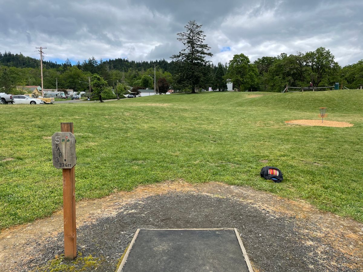 Hole 5 tee pad looking out towards the basket.