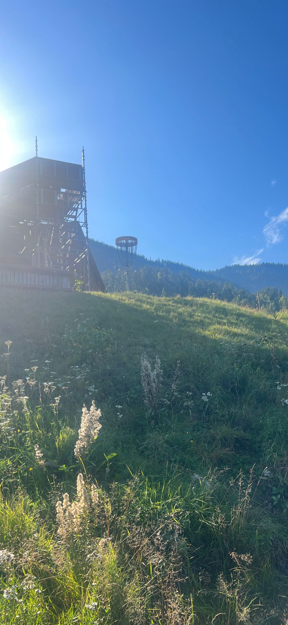 Basket 5, downhill on the north and norteast side, structure on southwest, flat on the northwest