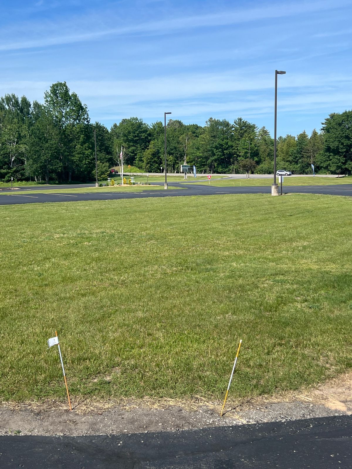 Tee pad 1 - right of the church mailbox near the main entrance of the church with the basket near the flagpole. 
For a challenge (and for leagues), play pavement OB.