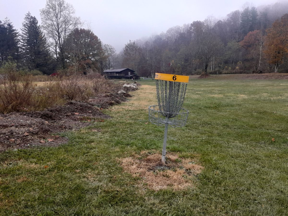 Hole 6 basket to tee (tee left of basket along drainage)
