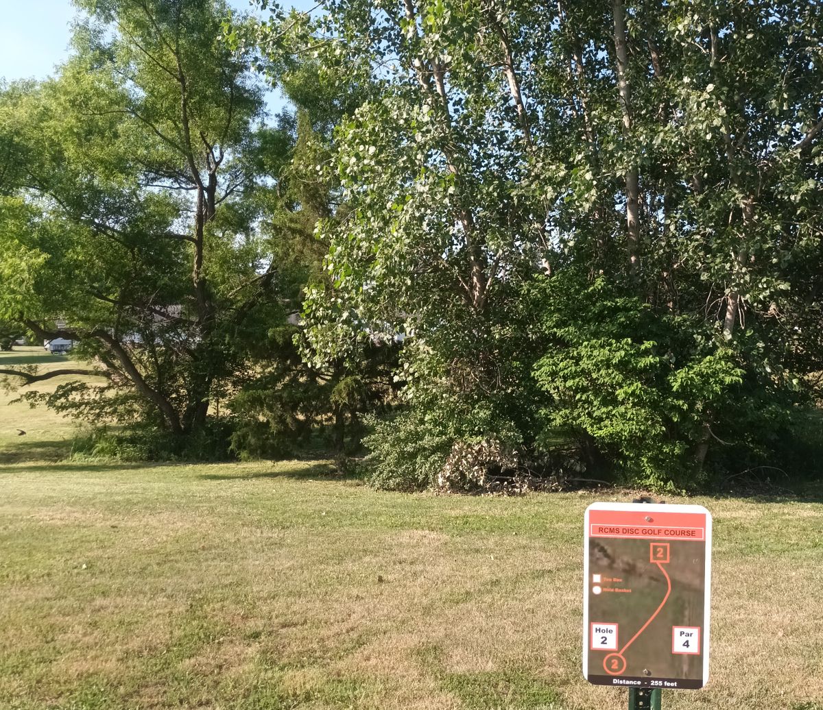 Hole 2.  Basket around 200ft past tree wall