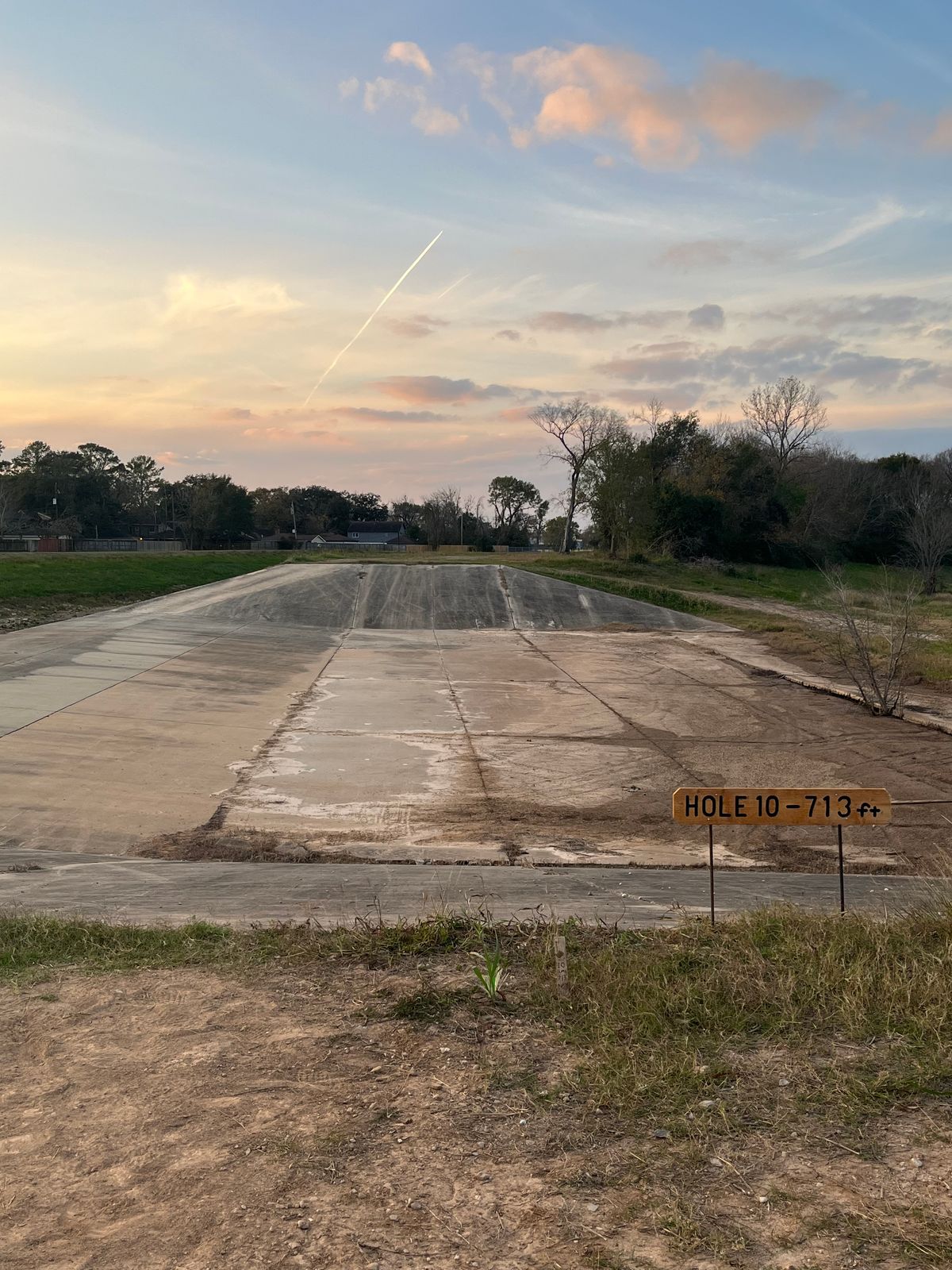 Hole 10 Long Tee 713ft - Basket in Long position along bayou.  Must clear concrete or proceed to Drop Zone on spillway.
