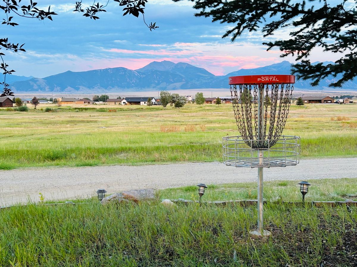 Hole 7 with the Madison Range sunset.