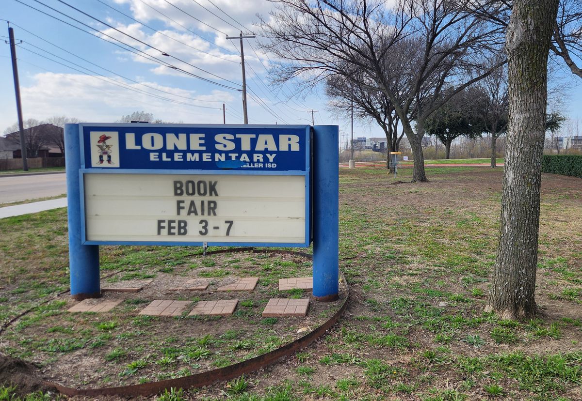 School marquee and #2 basket in background