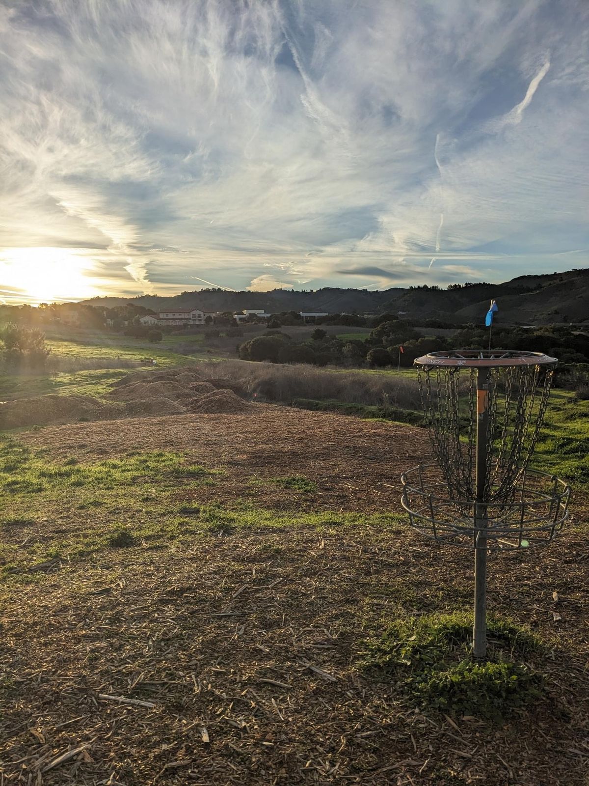 Sunrise looking back at Hole 27’s basket.