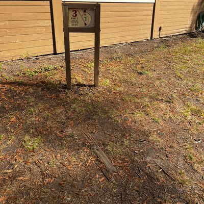 Hole 2 sign and “tee” - wood in the ground