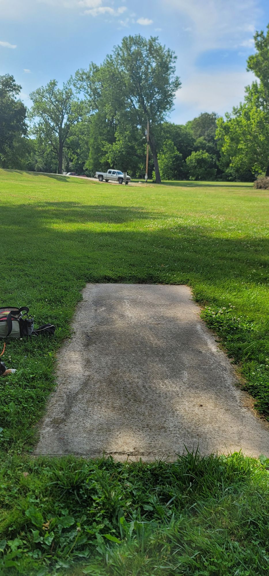 Cars right off the end of 7 tee pad