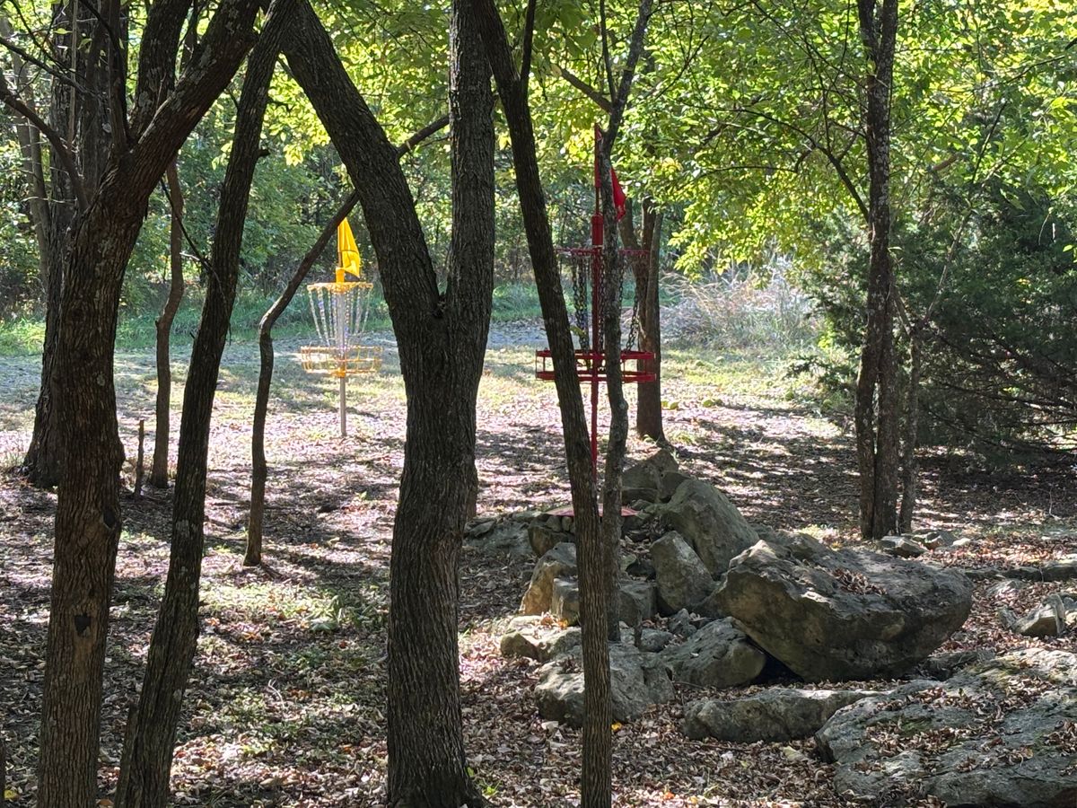 Hole 15 red elevated basket on top of rocks