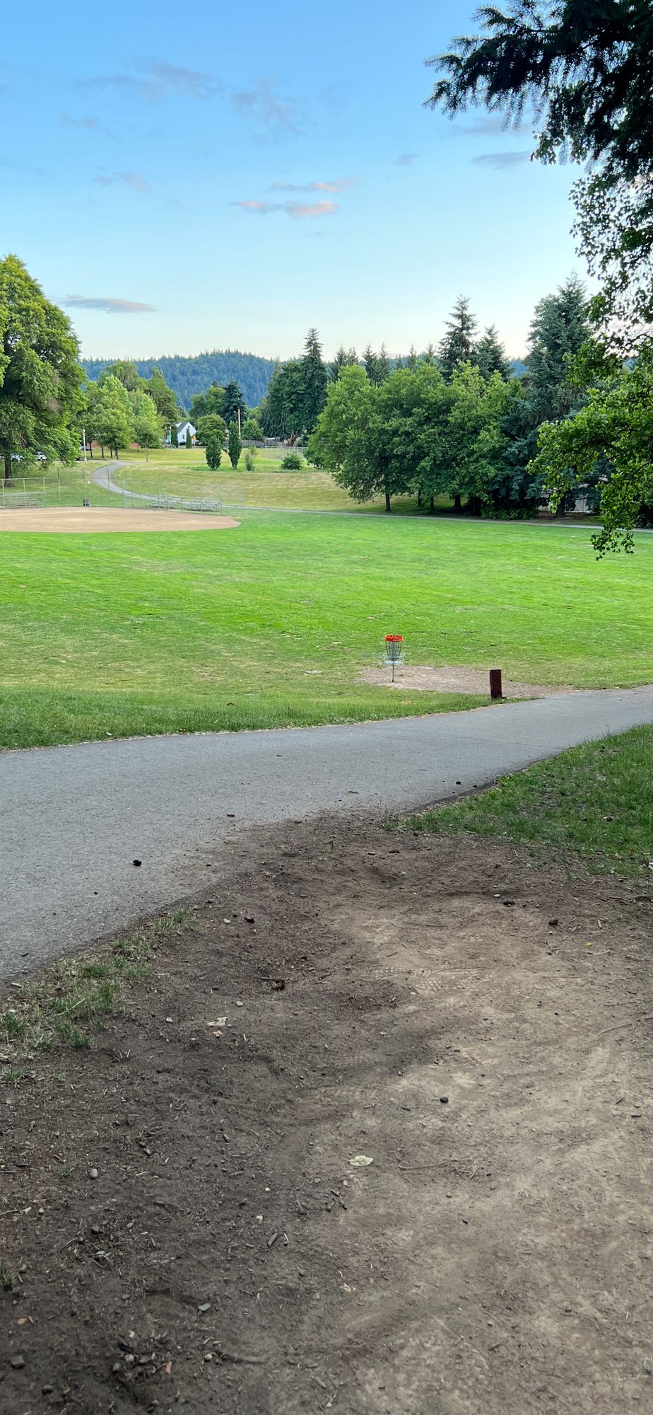 Hole 19 - Over the #2 basket, through the softball field, up the hill to the practice basket.