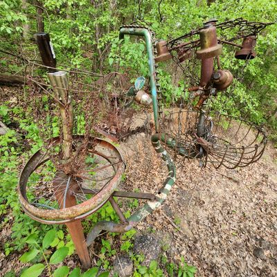 Reminiscent repurposed disc golf basket sculptures