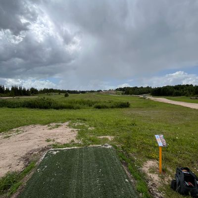 Hole 18 is surrounded by the motocross track. A long 305m par 5. Nice long hole to play.