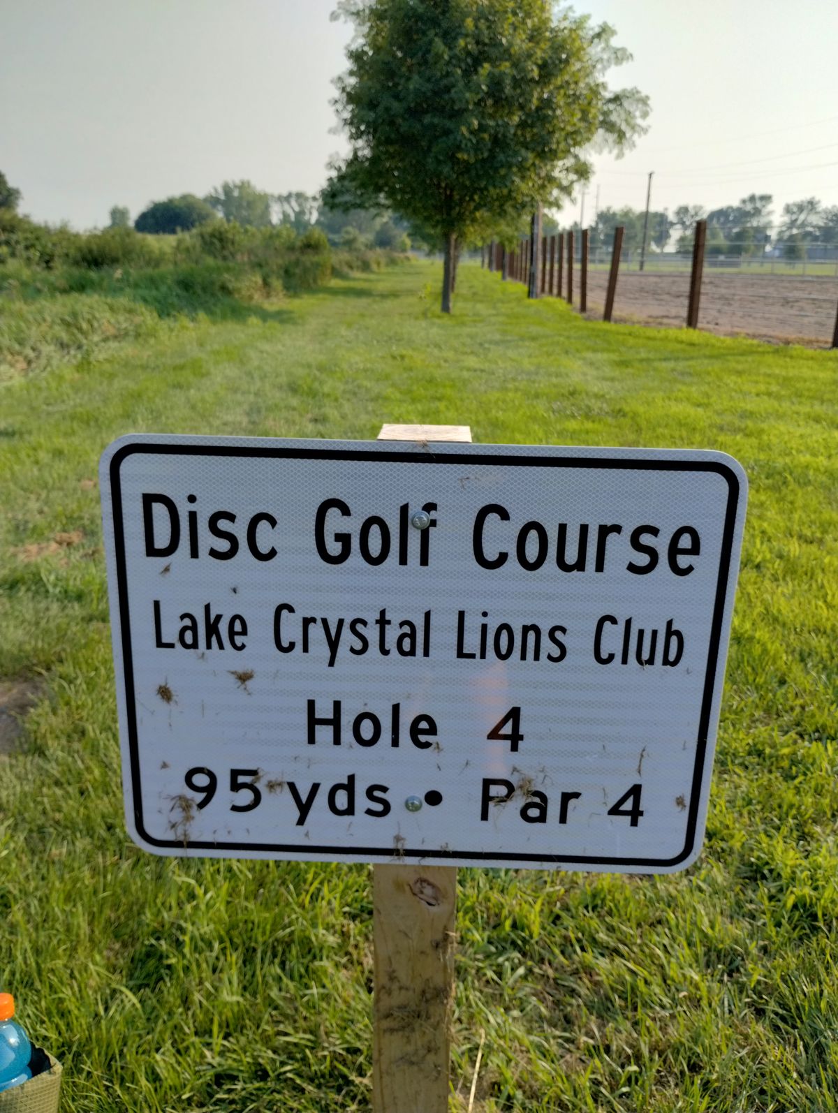 Hole 4, harder hole, tunnel shot with trees down the middle lowering the ceiling and the horse pen to the right and the drainage ditch to the left.