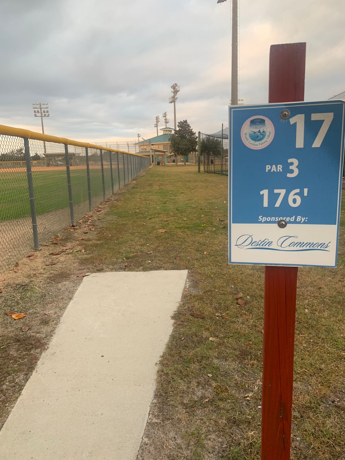 Around the batting cage to the right