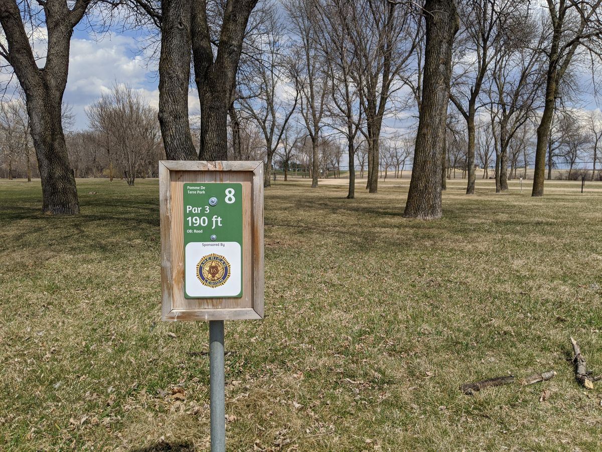 Hole 8 sign and basket