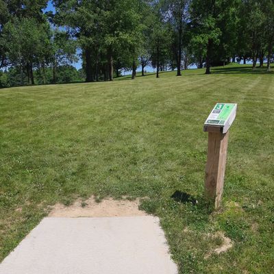 All tee pads have a post and sign in thr front right corner.  😞